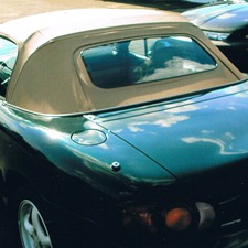 Restored green convertible with a new soft top